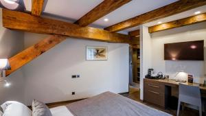 Postel nebo postele na pokoji v ubytování Michaelson Boutique Hotel & SPA Brícoła
