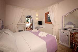 Łóżko lub łóżka w pokoju w obiekcie Hotel Balocco