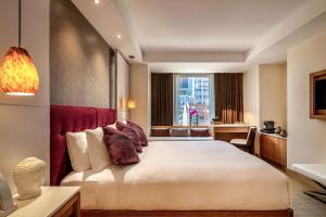 Postel nebo postele na pokoji v ubytování Concorde Hotel New York