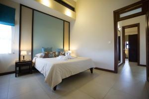 Voodi või voodid majutusasutuse Villasun Luxury Apartments & Villas toas