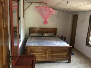 Postel nebo postele na pokoji v ubytování Yapahuwa Relax Stay