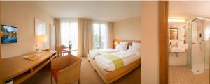 Postel nebo postele na pokoji v ubytování Hotel St Elisabeth
