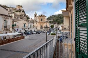a view of a street from a balcony of a city at Scicli Albergo Diffuso in Scicli
