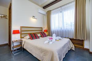 Voodi või voodid majutusasutuse Villasun Luxury Apartments & Villas toas