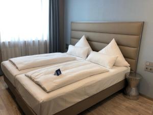 Postel nebo postele na pokoji v ubytování Belle Blue Zentrum