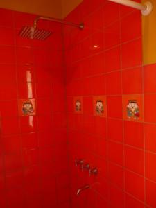 a red tiled shower with a red wall at Los Remenizos Cabañas de Montaña in Belén +100 photos