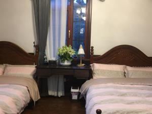 Voodi või voodid majutusasutuse Nordic Memory in Qingdao toas
