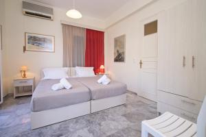 a bedroom with a large bed with two white pillows at Prince Studios in Sami