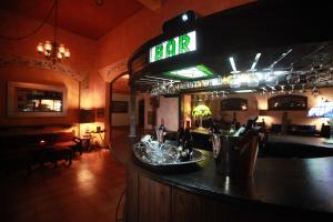 a bar in a restaurant with a bar sign at Hotel Montetaxco in Taxco de Alarcón