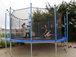 a group of people playing on a trampoline at Hotel Del Valle Quilimari in Pichidangui