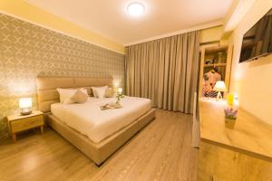 Postel nebo postele na pokoji v ubytování Hotel Baron