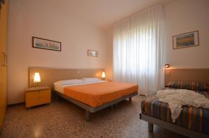 A bed or beds in a room at Ville Giusi, Maria e Campiello
