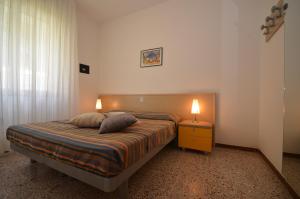 A bed or beds in a room at Ville Giusi, Maria e Campiello