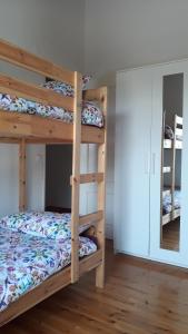 a bunk bed room with two bunk beds at Casa dos Coelhos in Barão de São João