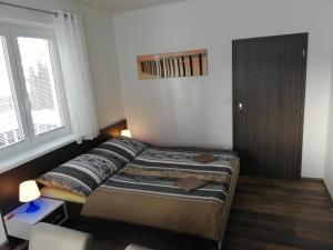 Postel nebo postele na pokoji v ubytování Apartmany Agatha