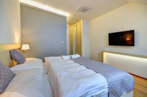 Postel nebo postele na pokoji v ubytování hotel Chmelnice