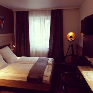 Postel nebo postele na pokoji v ubytování Hotel Wacker