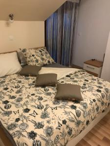 Postel nebo postele na pokoji v ubytování Apartman MIG