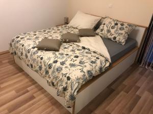 Postel nebo postele na pokoji v ubytování Apartman MIG