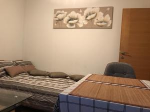 Postel nebo postele na pokoji v ubytování Apartman MIG