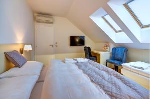 Postel nebo postele na pokoji v ubytování hotel Chmelnice