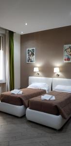 Posteľ alebo postele v izbe v ubytovaní Mia Suites