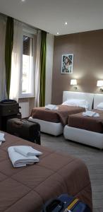 Posteľ alebo postele v izbe v ubytovaní Mia Suites