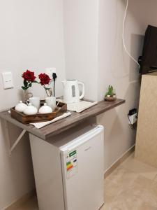 a kitchen with a counter top on top of a refrigerator at RY Courtyard in Oshakati