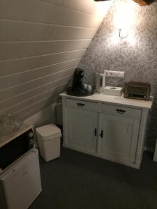 a bathroom with a sink and a counter with a toilet at Himmel & Hölle in Quedlinburg +34 photos