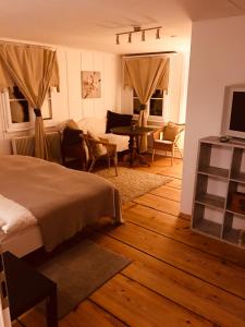 TV a/nebo společenská místnost v ubytování B&B Bären