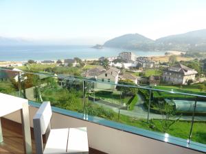 a balcony with a view of the ocean at Hotel Ego in Viveiro