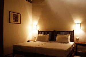 Postel nebo postele na pokoji v ubytování Sala Done Khone Hotel