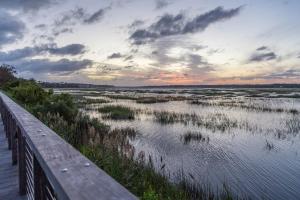 a view of a body of water with a wooden bridge at Ocean Breeze 23 in Hilton Head Island