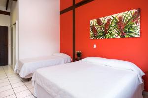 Ένα ή περισσότερα κρεβάτια σε δωμάτιο στο Pousada Peixes do Mar