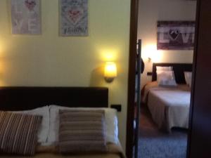 A bed or beds in a room at Il Ghetto Farm Holiday