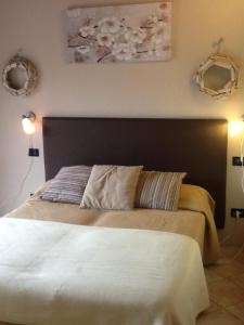 A bed or beds in a room at Il Ghetto Farm Holiday