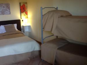 A bed or beds in a room at Il Ghetto Farm Holiday