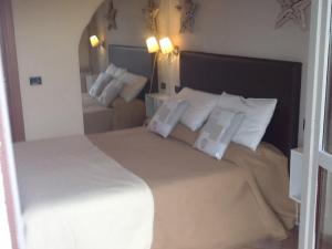 A bed or beds in a room at Il Ghetto Farm Holiday