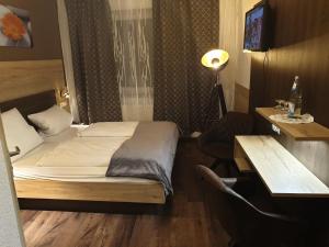 Postel nebo postele na pokoji v ubytování Hotel Wacker