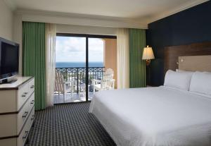 a hotel room with a view of the ocean at Residence Inn by Marriott Delray Beach in Delray Beach