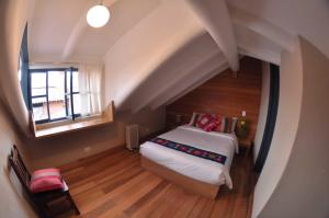 Postel nebo postele na pokoji v ubytování Nao Victoria Hostel