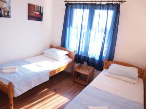 Postel nebo postele na pokoji v ubytování Apartments Adria