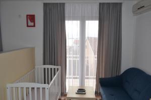 Postel nebo postele na pokoji v ubytování Apartments Adria