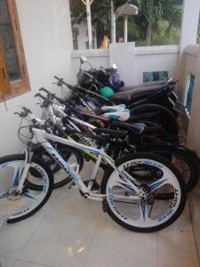 a row of bikes parked next to a wall at The House 17/1 in Mui Ne