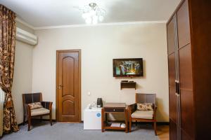 TV a/nebo společenská místnost v ubytování Totem Hotel