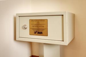 a white box on a wall with a sign on it at Cortona Inn and Suites Anaheim Resort in Anaheim