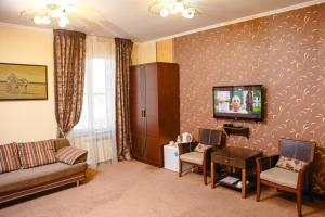 TV a/nebo společenská místnost v ubytování Totem Hotel