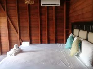 Postel nebo postele na pokoji v ubytování Hotelito Villas Holbox