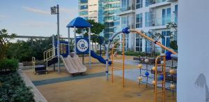 a playground in front of a building at Apartment Sea View at Mactan Newtown in Mactan