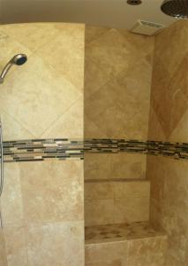 a shower in a bathroom with a tile floor at Sealodge H9 Condo in Princeville